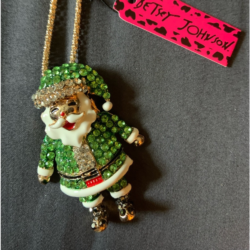 BJ green jolly Old St. Nick with a cute toboggan.  Length 12” from back of neck.